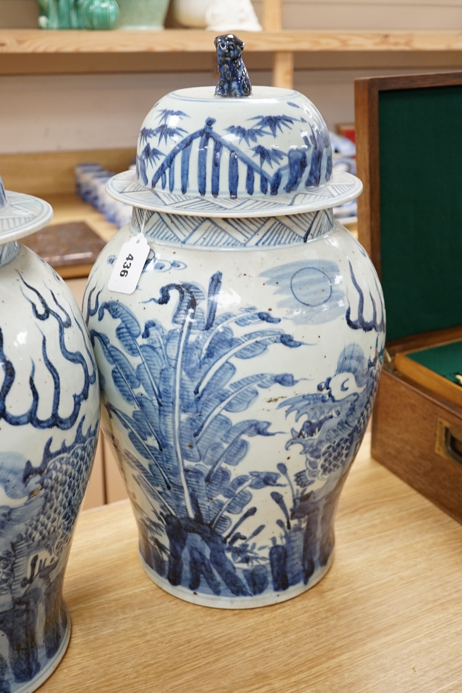 A pair of large Chinese blue and white ginger jars and covers, 54cm high. Condition - fair to good